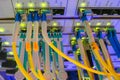 Data center. A lot of optical links are lit on the front panel of the central Internet router. Fiber-optic wires are connected to Royalty Free Stock Photo