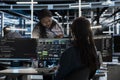 Data center manager supervising engineer setting up machine learning systems Royalty Free Stock Photo