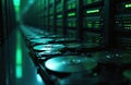 Data center with multiple hard drives for information storage. Servers arrays perform data processing. Blurred long server room Royalty Free Stock Photo