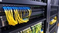 Data center network server rack with fiber optic cables connected for data transfer Royalty Free Stock Photo