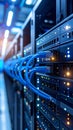 Data center server racks with blue network cables and blinking lights for data storage Royalty Free Stock Photo
