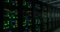 Data Center Server Racks with Illuminated Panels in Dark Room Technology Infrastructure for Cloud Computing Green Blue Royalty Free Stock Photo