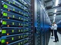 Data center with server racks and IT professionals working Royalty Free Stock Photo