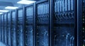 Data Center Server Racks in a Row Lit with Blue Light Showcasing Advanced Technology Infrastructure Royalty Free Stock Photo