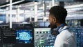 Data center system administrator using AI neural network models Royalty Free Stock Photo