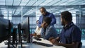 Data center team leader supervising engineers implementing AI