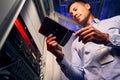 Data center IT technician examining new HDD Royalty Free Stock Photo