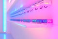 Data center with vibrant pink and blue lighting visualizing modern network management secure data infrastructure and high speed