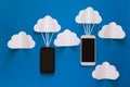 Data communications and cloud computing network concept. Smart phone flying on paper cloud. Royalty Free Stock Photo