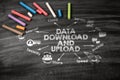 DATA DOWNLOAD AND UPLOAD Concept. Black scratched textured chalkboard background Royalty Free Stock Photo