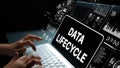 Data Lifecycle Management Visualization with Hands Typing on Keyboard and Digital Graphics Background. Asymptotic smart Royalty Free Stock Photo
