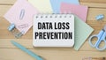 Data Loss Prevention sign on notepad