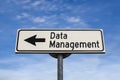 Data Management road sign, arrow on blue sky background. One way blank road sign with copy space. Arrow on a pole pointing in one Royalty Free Stock Photo