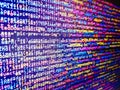 Data monitor numbers. PHP syntax highlighted. Screen at workplace of modern programmer on n. Shallow depth of field. Writing Royalty Free Stock Photo