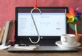 Data phishing, big hook on laptop computer showing fictional phishing website, blurred in the background Royalty Free Stock Photo