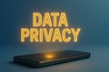 Data privacy concept with glowing text above a smartphone, suitable for backgrounds Royalty Free Stock Photo