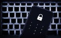 Data privacy in phone with password code. Smartphone on laptop keyboard. Lock to protect personal bank from hacker, cyber fraud.
