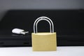 Data privacy protection concept is shown using metal lock and storage device with a computer on background, Cybersafety concept Royalty Free Stock Photo