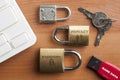 Data protection concept: three locks, an usb key and a pair of key on a wooden table Royalty Free Stock Photo
