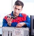 The data restoration specialist repairing corrupt hard drive Royalty Free Stock Photo