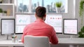 A data scientist, standing in front of multiple large screens displaying complex graphs and charts Royalty Free Stock Photo