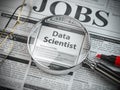 Data scientist vacancy in the ad of job search newspaper with loupe