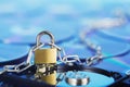 Data security, information protection and personal information defense. Padlock on hard drive disk at CD disk background. Concept Royalty Free Stock Photo