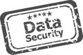 Data security on rubber stamp over a white background Royalty Free Stock Photo