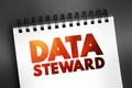 Data steward - oversight or data governance role within an organization, text concept on notepad for presentations and reports