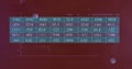Data table with numerical values over red background with geometric shapes image