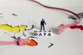 DATA text on white cube and LAN Line on top of the world map. A miniature police holding a loudspeaker.