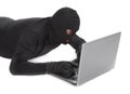 Data thief with laptop Royalty Free Stock Photo