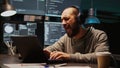 Database admin having fun listening to music on headset