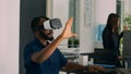 Database admin working with virtual reality glasses to develop server app