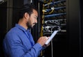 Database tablet, server room and engineer man looking at research for maintenance or software update at night Royalty Free Stock Photo