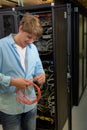 Datacenter specialist working with optical cable