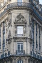 Datail of the front and narrow triangle Haussmannian architecture building on the Reaumur Boulevard in Paris