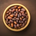 Date display Top view of dates in a wooden bowl