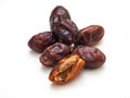 Date fruit with seeds on white background.
