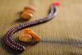 Date fruits with an Islamic prayer beads on an artistic background. Beautiful background for Ramzan or Ramadan.