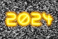 The date 2024 in glowing numbers on a textured background