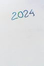 2024 date handwritten in a text script with a black marker pen on a blank white background