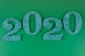 the date of the new two thousand and twentieth year is shown in closeup on a green background