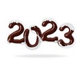 Date of the New Year 2023 made of melted chocolate with milk splashes