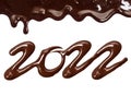 Date of the new year 2022 written by melted chocolate on a white background Royalty Free Stock Photo