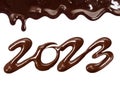 Date of the new year 2023 written by melted chocolate on a white background Royalty Free Stock Photo