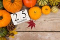 Date 25 november, thanksgiving surrounded with pumpkins