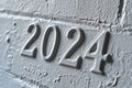 2024 date text on a distressed white wall background