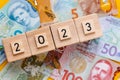 2023, date on wooden blocks, New Zealand dollar, all banknotes, Economic concept, Country development in 2023