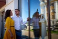 A date between a young girl and a guy on a Sunny summer day. Young beautiful couple on walk in the city. Man and woman at a love Royalty Free Stock Photo